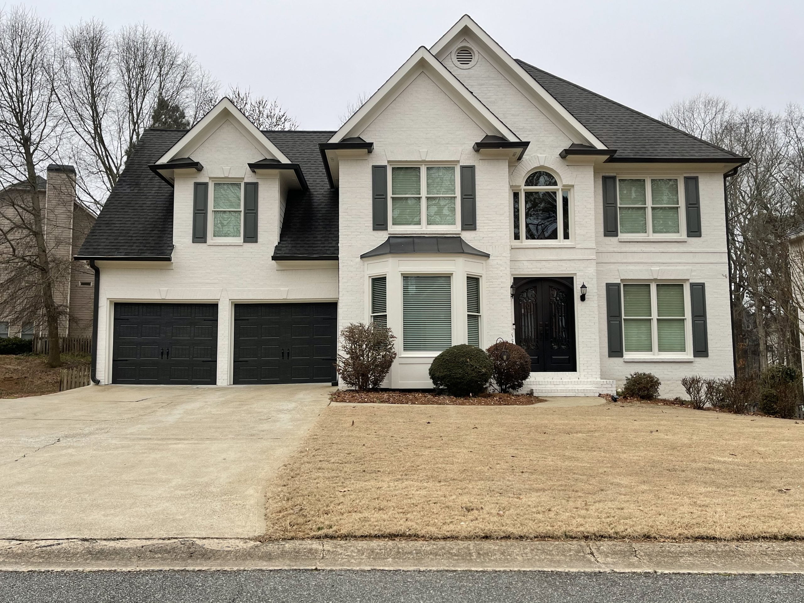 Painted brick exterior of a Woodstock home
