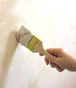 Carefully apply touch up paint to your walls and trim.