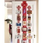 Display Christmas cards from ribbons on your doors.