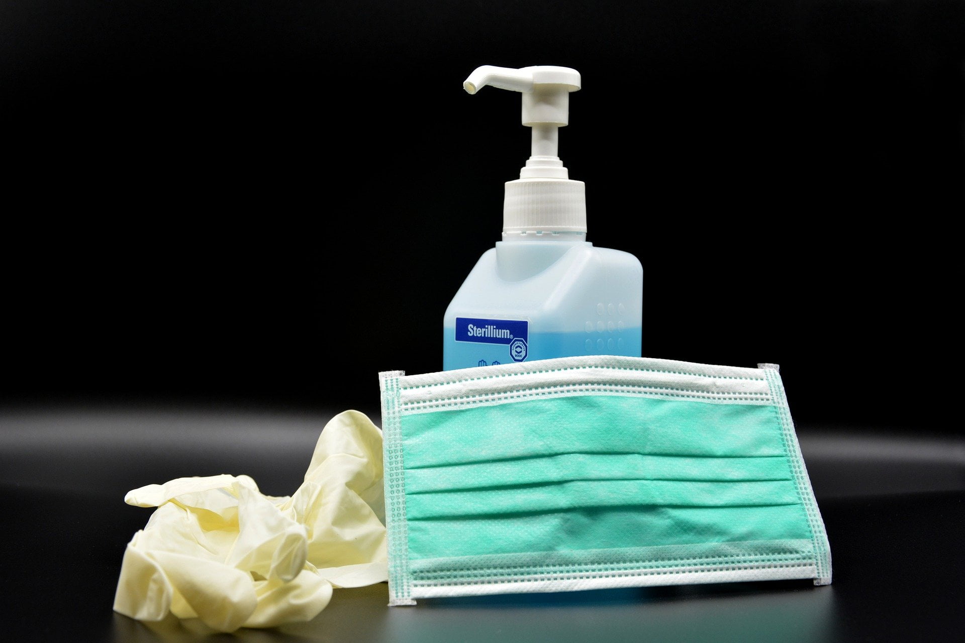Image of gloves, face mask, and hand sanitizer